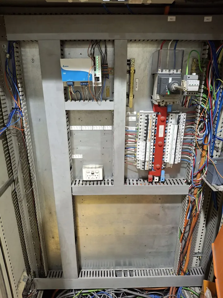 Upgraded switchboard stripped back to supply, protection and a few terminal rails with a largely empty backplate